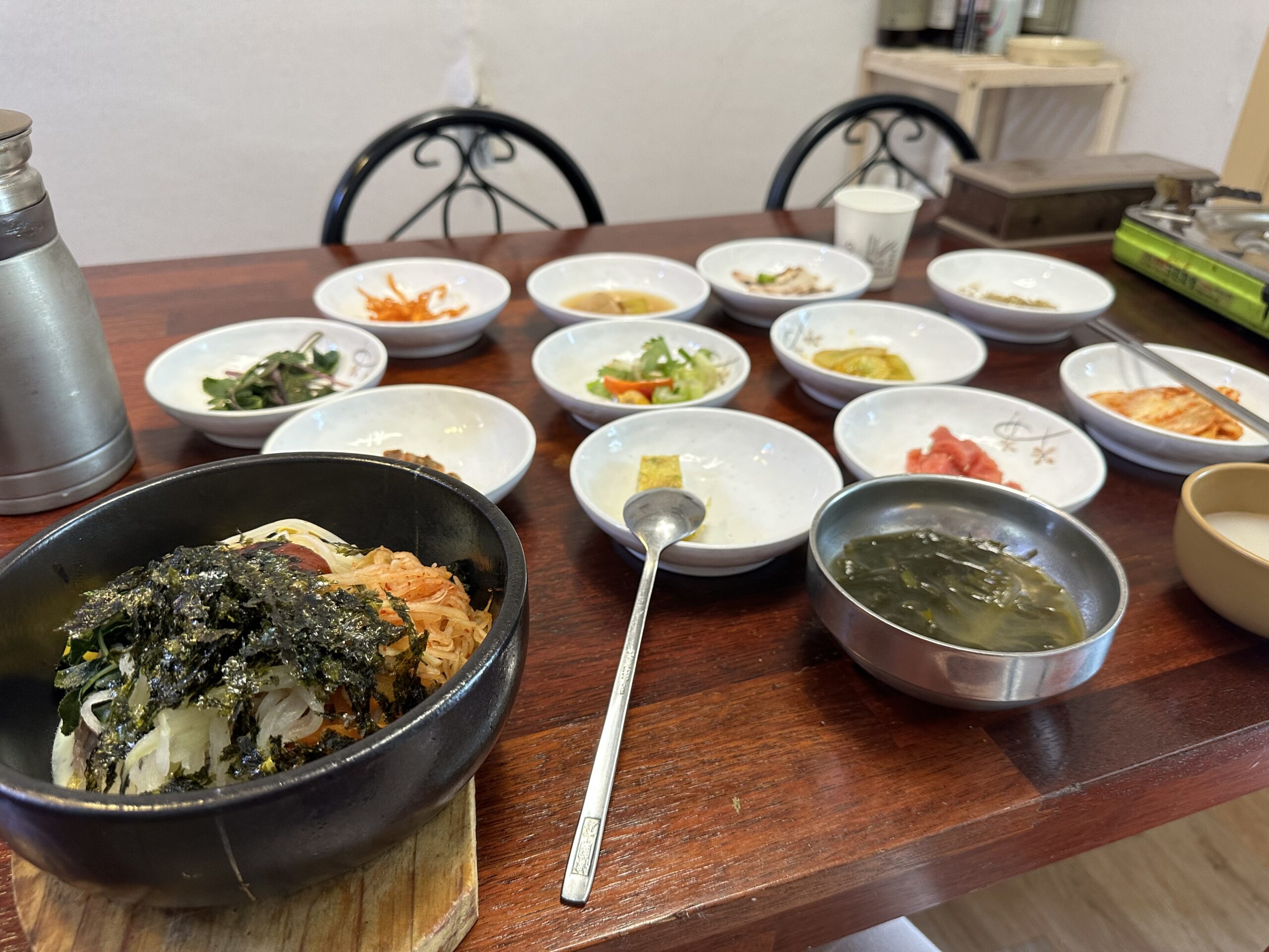 Bibimbap with banchan (side dishes) for lunch.
